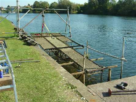 Downstream ramp lifted out of water to repair