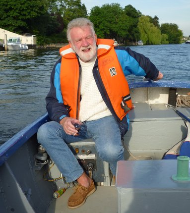 Mike Hendra helming the patrol boat